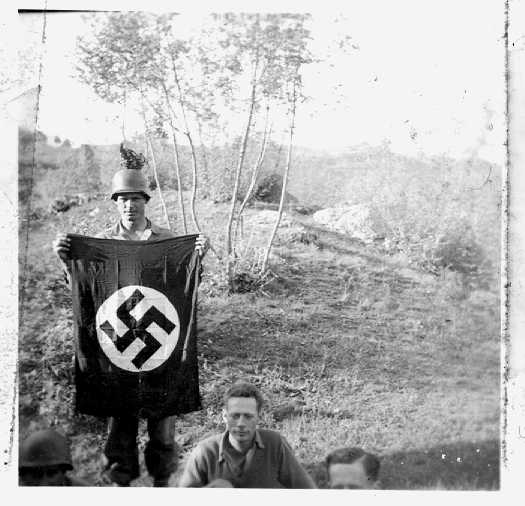 Cole displaying captured Flag and Helmet